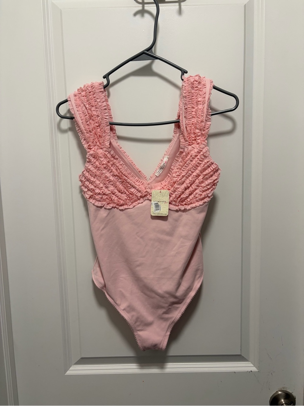 Free people intimately punk ruffle body suit snap nwt tiny light spot